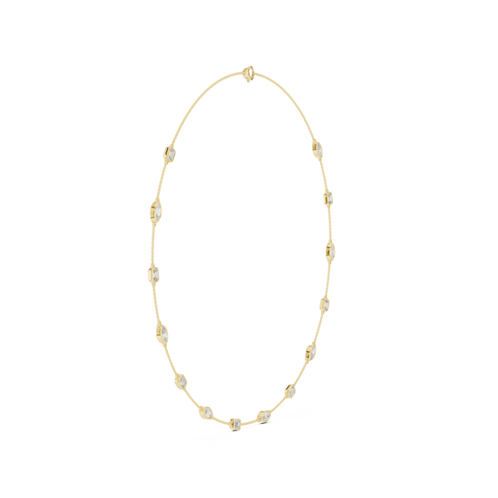 Gold necklace with small beads on a white background