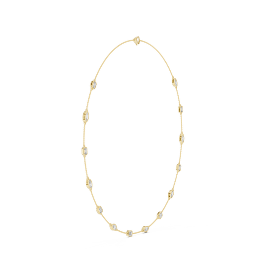 Gold necklace with small beads on a white background