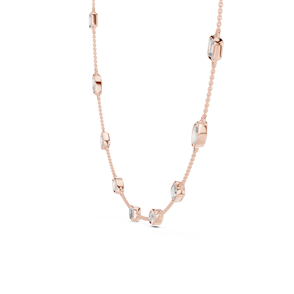 Rose gold necklace with diamond-like stones on a white background