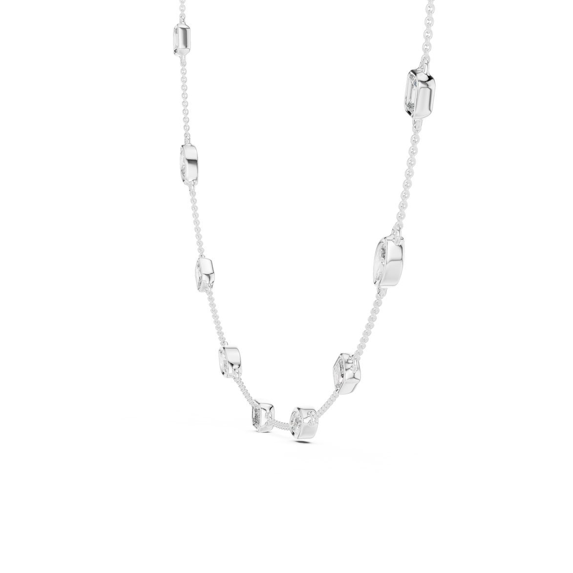 Silver necklace with various shaped pendants on a white background