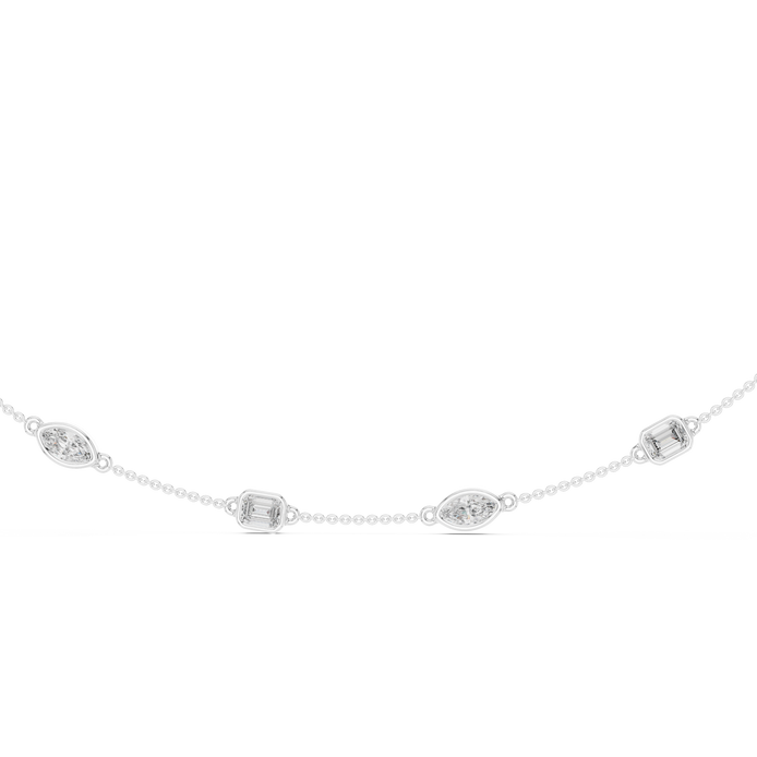 Delicate silver necklace with small circular pendants on a white background
