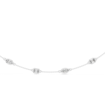Delicate silver necklace with small circular pendants on a white background