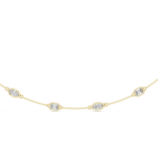 Gold necklace with diamond-like stones on a white background