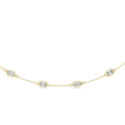 Gold necklace with diamond-like stones on a white background