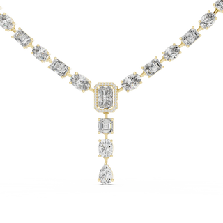 Diamond necklace with gold and silver chain on a white background