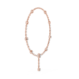 Rose gold necklace with key pendant on a white background