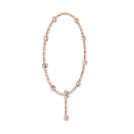 Rose gold necklace with key pendant on a white background