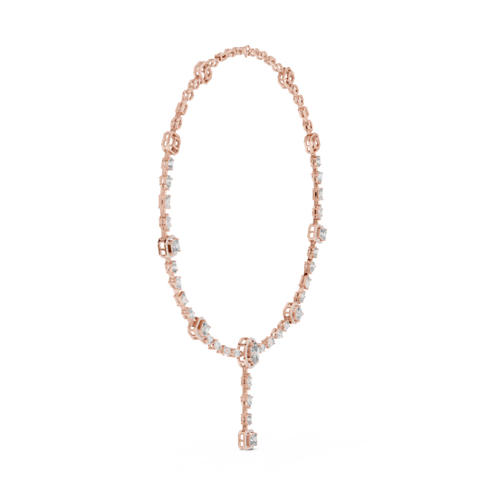 Rose gold necklace with key pendant on a white background