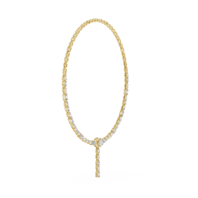 Gold necklace with small beads on a white background