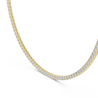 Gold necklace with diamonds on a white background