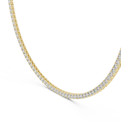 Gold necklace with diamonds on a white background