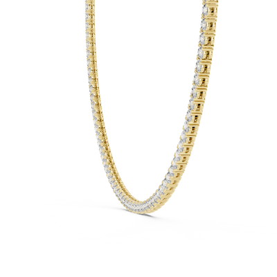 Gold chain necklace with embedded diamonds on a white background