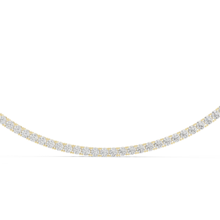 Gold and diamond necklace on a white background