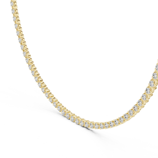 Gold necklace with diamonds on a white background