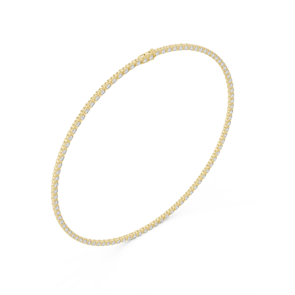 Gold necklace with small round beads on a white background