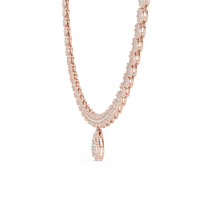 Silver necklace with a teardrop pendant on a white background