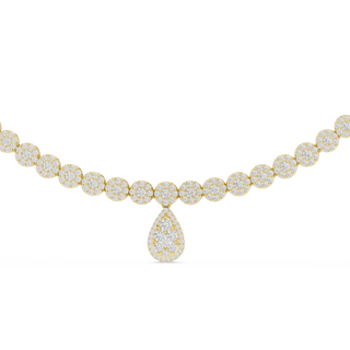 Gold necklace with a teardrop-shaped pendant on a white background