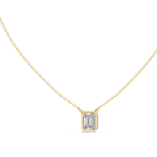 Emerald cut lab grown diamond bezel solitaire pendant in yellow gold