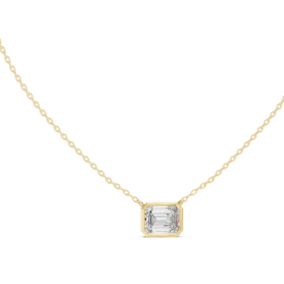Emerald cut east-west lab grown diamond bezel pendant in yellow gold