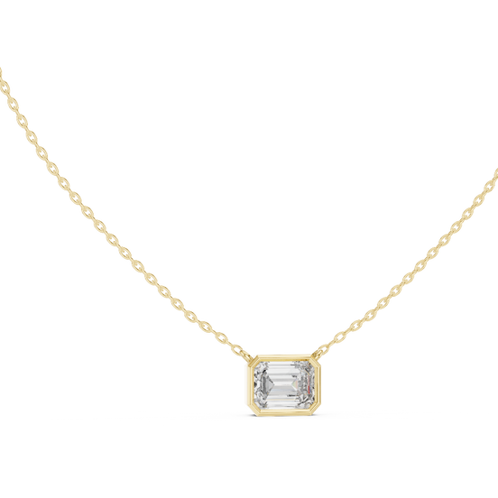 Emerald cut east-west lab grown diamond bezel pendant in yellow gold
