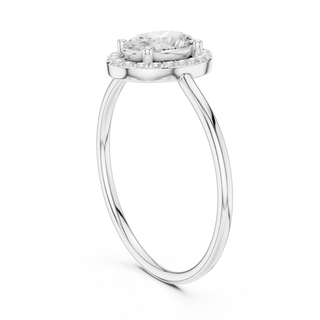 Oval lab grown diamond halo ring in white gold