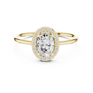 Oval lab grown diamond halo ring in yellow gold