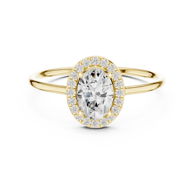 Oval lab grown diamond halo ring in yellow gold