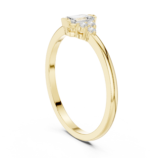 emerald diamond three stone engagement ring in yellow gold