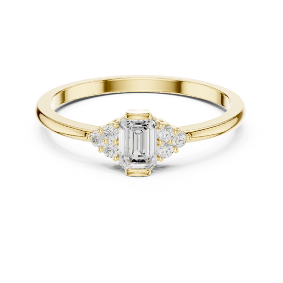 emerald diamond three stone engagement ring in yellow gold