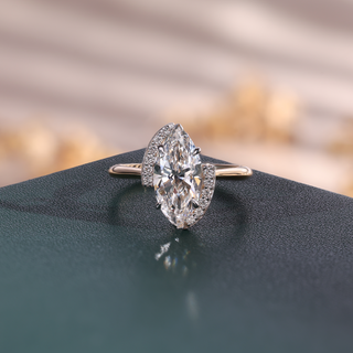Marquise lab grown diamond bypass engagement ring in yellow gold with two curved pavé accents.