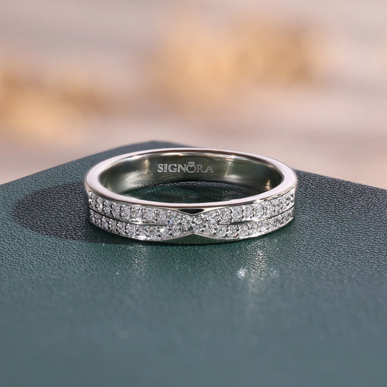 White gold lab grown diamond crossover wedding ring with two curved pavé rows meeting at the center.