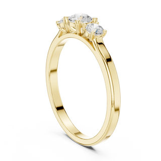 Round diamond three stone ring in yellow gold