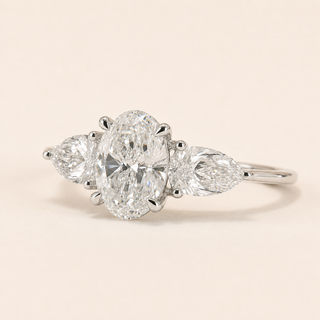 Oval Cut Lab Grown Diamond Three-Stone Engagement Ring in White Gold with Pear Side Diamonds