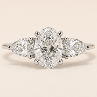 Oval Cut Lab Grown Diamond Three-Stone Engagement Ring in White Gold with Pear Side Diamonds