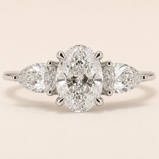 Oval Cut Lab Grown Diamond Three-Stone Engagement Ring in White Gold with Pear Side Diamonds