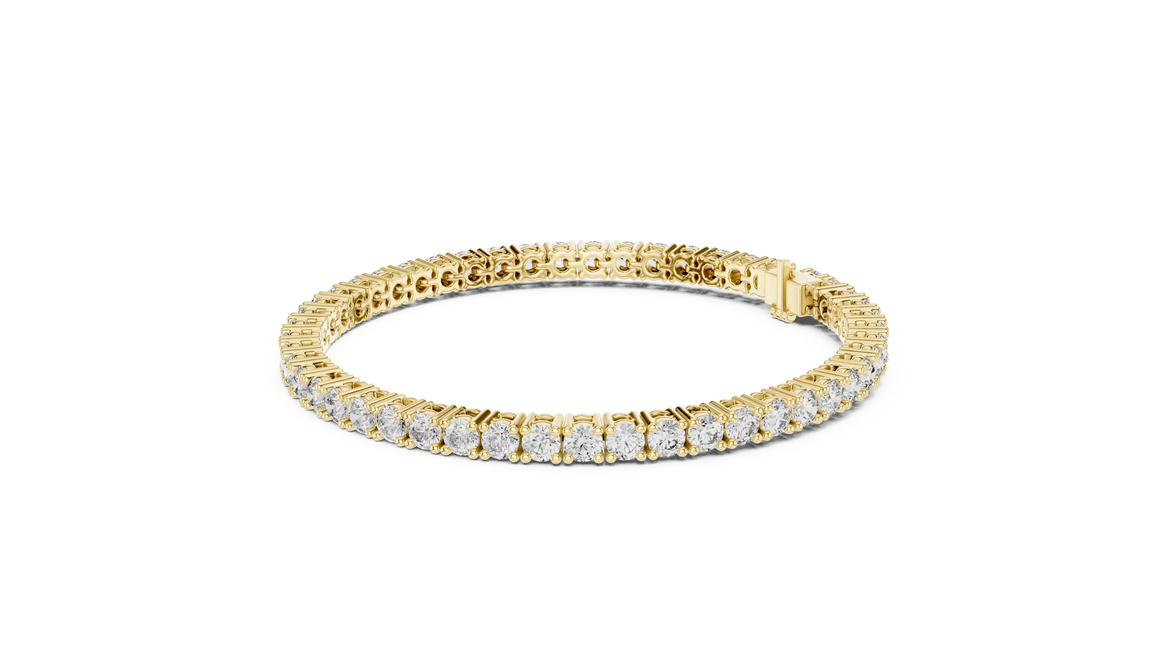 Gold bracelet with diamonds on a white background
