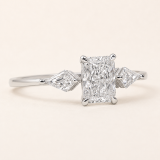 Radiant cut Lab Grown Diamond three-stone engagement ring in white gold with kite side diamonds and plain shank