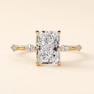 Radiant Cut Lab Grown Diamond Hidden Halo Engagement Ring with Marquise Accent Shoulders in Yellow Gold