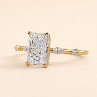 Radiant Cut Lab Grown Diamond Hidden Halo Engagement Ring with Marquise Accent Shoulders in Yellow Gold