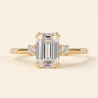 Emerald Cut Lab Grown Diamond Three-Stone Engagement Ring with Tapered Baguette Side Diamonds in Yellow Gold