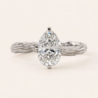 Oval Lab Grown Diamond nature inspired engagement ring in white gold with a twisted vine shank and four-prong cathedral setting.