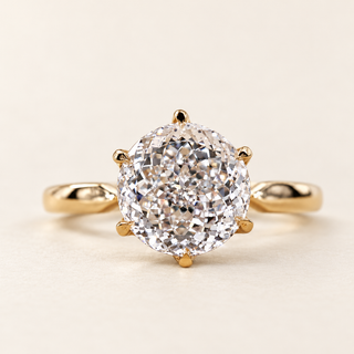 Portuguese cut round Lab Grown Diamond engagement ring in white gold with a six-prong lotus basket and pinched comfort-fit shank.