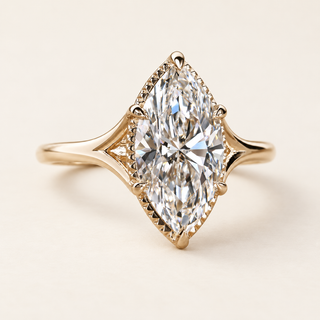 Marquise cut lab grown diamond engagement ring with 2.00 ct center, protective pointed-end prongs, fine milgrain edging and open split-shank shoulders in yellow gold.