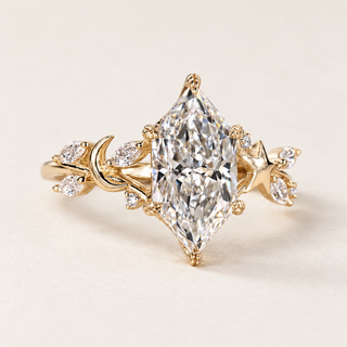 Dutch marquise cut lab grown diamond engagement ring with 2 ct center, leaf-shaped protective prongs, crescent moon, star and marquise diamond accents in yellow gold.