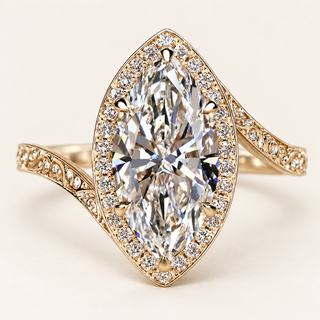 Marquise cut lab grown diamond engagement ring with elongated center, full pavé diamond halo, sculpted bypass shoulders and decorative openwork in yellow gold.