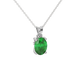 Close-up emerald green gemstone pendant, white gold surprise diamond setting.