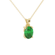 Close-up, oval cut emerald green gemstone, yellow gold surprise diamond pendant.
