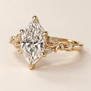 Dutch marquise cut lab grown diamond engagement ring with protective pointed-end prongs, swirling botanical filigree, round diamond accents and polished yellow gold.