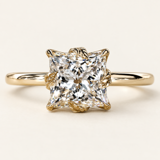 Princess cut lab grown diamond engagement ring with 2.00 ct square center, sculpted leaf-shaped gold prongs, floral basket and plain polished yellow gold shank.