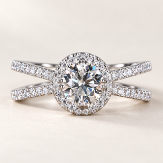 Round lab grown diamond engagement ring in white gold with pavé halo, double-row split shank and diamond-set crossover shoulders